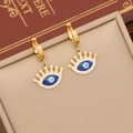 Goldene Creolen mit Evil Eye Krone aus blauem Emaille und funkelnden Kristallen - Ohrringe