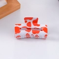 Red and white cow print rectangular hair claw clip made of glossy acrylic material - Red and White Cow Print