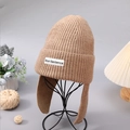 Winter women's khaki knit beanie hat with ear flaps and Short Sentence patch detail - Camel