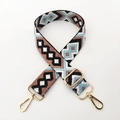 Detail of colorful geometric woven bag strap with golden metal lobster clasps and buckle - Bean Paste Blue White