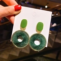 Handcrafted green woven hoop earrings with gold-plated accents and pearl details - Woven Hoop Earrings / Green