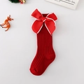 Detalle de calcetines navideños rojos para bebés con lazo de terciopelo y punto acanalado - XS (0-1 Años) / Rojo