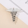 Spilla Caduceo vintage in metallo argento con ali in smalto bianco e dettagli precisi - Caduceo Argento