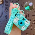 Mint green cartoon cat projection camera keychain with 8 patterns and silicone strap - Teal Cat