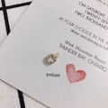 Detail view of 8x6mm gold-plated rhinestone charm on a decorative backdrop card - 6mm Single Loop 14K Gold