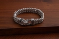 Macro shot of vintage silver stainless steel braided chain with detailed snake head clasp - Large Snake Head