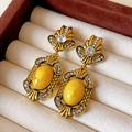 Orecchini vintage a fiocco dorati con pietra gialla e cristalli su un cuscinetto testurizzato - 3# Perno in Argento Oro Giallo
