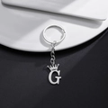 Silver stainless steel keychain featuring a crown-topped letter G pendant on a plate - Letter G Crown Style (G)