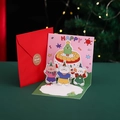 Pink 3D pop-up Christmas card with cartoon animals and cake on a green surface - Christmas Cake / 12x12cm (Including Envelope/Sticker)