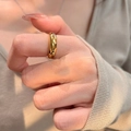 Exquisite gold finish vintage style ring with pink stones on a woman's finger - Gold Smooth Circular Band Basic Ring (J7052)