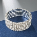 Close-up of a 5-row silver elastic bracelet featuring sparkling claw-set rhinestones - 6 Rows / Silver