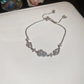 Macro detail of silver-tone gourd bracelet with white pearls and sparkling zircons - Gourd Shape (WB856 WB867) / Silver-Blue