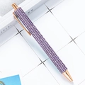 Purple crystal encrusted ballpoint pen with rose gold trim in 45-degree view - Violet (Rose Gold Parts)