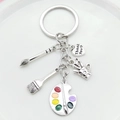 Artistic silver keychain with paintbrush, palette, and heart shaped Thank You charm - Palette and Brush Keychain Style