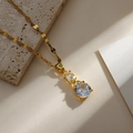 Detail of gold necklace featuring two stacked clear crystals on a flat curb link chain - Gold Vertical Double Stone Style