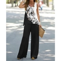 Detail of floral print sleeveless top paired with black high-waisted wide-leg trousers - S / Black and White Floral