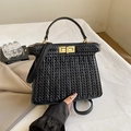 Elegant black woven leather handbag with golden square twist lock and top handle strap - Black