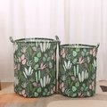 Set of two green fabric storage bins with tropical leaf patterns and dual handles - 35*45cm / Moss Agate