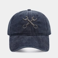 Washed navy blue cotton baseball cap featuring vintage wrench cross embroidery on the front - Adjustable / Navy Blue