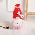 Christmas gnome doll with red knitted hat, white beard and green tree bow ornament - Red