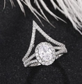 Elegant halo ring with oval cubic zirconia and V-shaped pave diamond double band - Ur0721