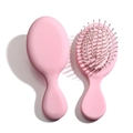 Mini portable pink hair brush with heart-shaped design and massaging air cushion bristles - Tender Pink - Elastic Paint