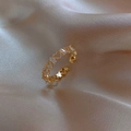 Macro shot of vintage gold open ring with hollow hearts and rectangular zircon stones - Gold Heart Zirconia Style (47#)