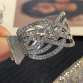 Pince à cheveux argentée ajourée avec strass brillants pour queue de cheval - 6 Rangs Croisés Strass / Argent