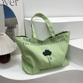 Large olive green canvas tote bag featuring minimalist black art print and lettering - Green