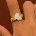 Macro shot of vintage gold heart watch ring featuring a textured band and white dial - Gold White Heart Face (7901)