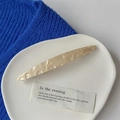 Detail of handmade cream acetate hair clip with embossed texture on a ceramic plate - Oval Clip / Beige