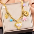 Golden necklace with pink flowers, large pearl hearts and colorful charms on pink satin - Gold Multi-element Pendant
