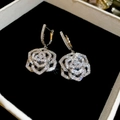 Macro detail of silver camellia earrings with sparkling cubic zirconia on black velvet - 32# Silver Camellia Petal Hoop Earrings