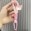 Pink woven mesh strap keychain with CURRENT logo and matching carabiner accessory - Light Pink