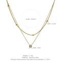 Zweilagige Edelstahlkette in Gold mit runden Perlen und klarem Steinanhänger - Zirkonia Doppel-Layer-Stil