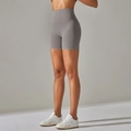 Close-up of grey high-waist yoga shorts showing seamless shaping and peach lift effect - Sea Moon Rock Grey