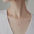 Minimalist s925 silver golden bead necklace with long pendant on female model - Gold