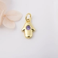 Detail of a gold Hamsa pendant featuring a central purple zircon for DIY jewelry crafts - Purple Zirconia