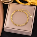 18K gold titanium steel wheat link bracelet with heart charm on jewelry box - Gold Wheat Chain Bracelet (SLE187)