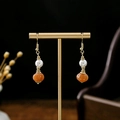 Detail of Chinese style drop earrings with white pearls and orange pumpkin beads - Orange Pumpkin Bead White Pearl (E1966-15)