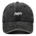 Close-up of 3D white embroidery on a black washed denim baseball cap with PAPI lettering - Black