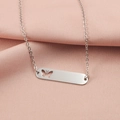 Close-up of silver rectangle pendant necklace with butterfly cutout on pink fabric - Hollow Butterfly Style (MP387-4) / Steel
