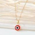 Gold stainless steel evil eye necklace with red enamel pendant on textured background - 18K Gold / Red Necklace