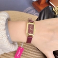 Elegant ladies square watch with gold case and burgundy leather strap worn on wrist - Gold/Wine Red (Square Mishali Style)