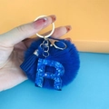 Deep blue pompom keychain with resin letter R pendant featuring blue heart glitter - Letter R