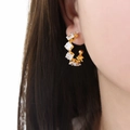 Elegant C-shaped gold plated earrings with zigzag square cubic zirconia stones - Gold