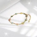 Gouden schakelarmband met kleurrijke hartvormige bedeltjes en boze oog kralen - Veelkleurig & Zwart Oog