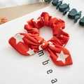Red Christmas hair scrunchie with white star patterns and a decorative bow tie - Red Pentagram