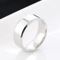 Macro detail of 4mm bevelled edge stainless steel ring with polished silver finish - US 7 / 8MM Silver