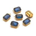 Detailed macro view of rectangular blue topaz pendants with gold settings and dual loops - 5 Pieces / Dark Blue